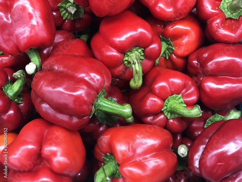 Red ripe bell peppers consist of capsaicin compound, red chilli texture or background, sell in market shelf for ingrediant cooking, restaurant photo decoration concept.