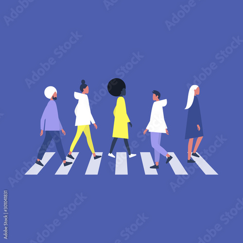 A crowd of people crossing a  pedestrian zebra, urban scene