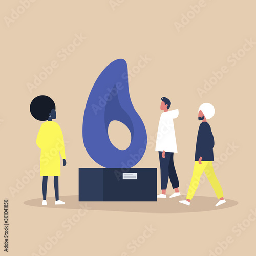 A group of people standing and walking around a contemporary public art installation