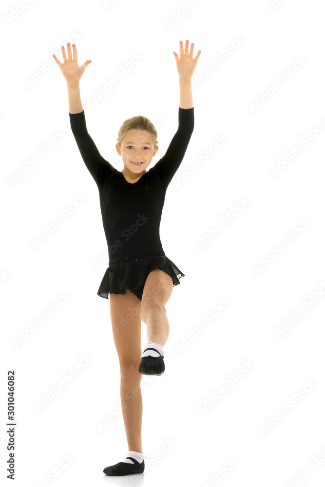 Cute little girl gymnast getting ready to perform a difficult ex Cute little girl gymnast getting ready to perform a difficult ex