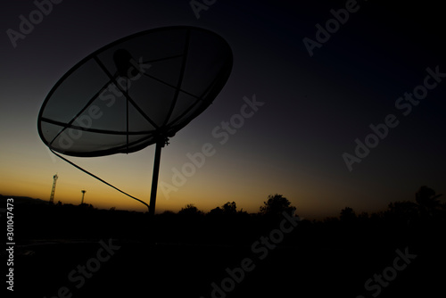 Silhouette of a small Satellite dish Communicator technology network.idebar with collapsible lists is being considered for merging.     A satellite dish is a dish-shaped type of parabolic antenna design