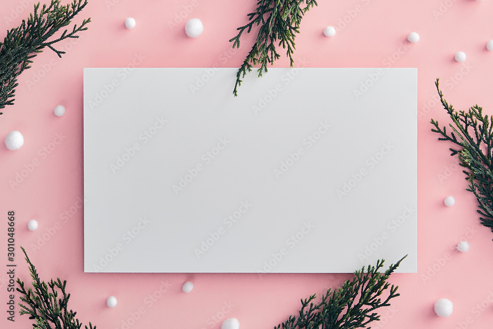 Christmas tree branch and snowball on pink background - obrazy, fototapety, plakaty 
