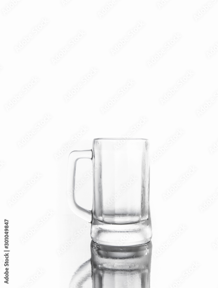 Glass mug on white background. Empty glass cup on white background. Glass mug on white background. Empty glass cup on white background.