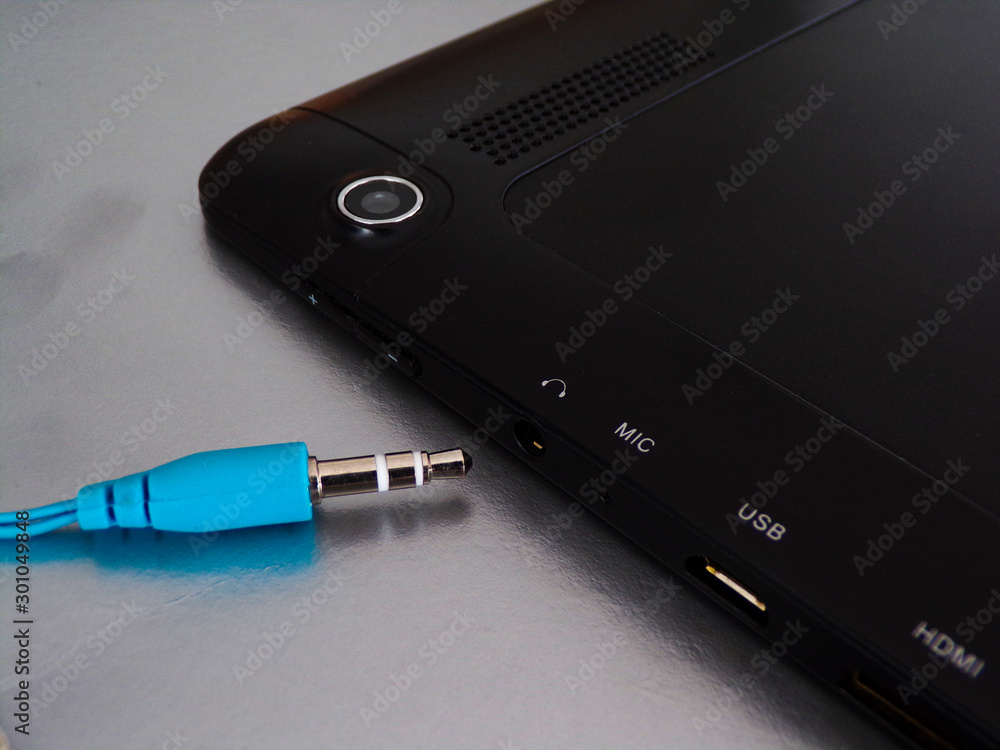 The headphone plug is next to the headphone Jack for connecting your tablet or phone. Wired headphones that are outdated. On replacement wired came wireless headphones. The headphone plug is next to the headphone Jack for connecting your tablet or phone. Wired headphones that are outdated. On replacement wired came wireless headphones.