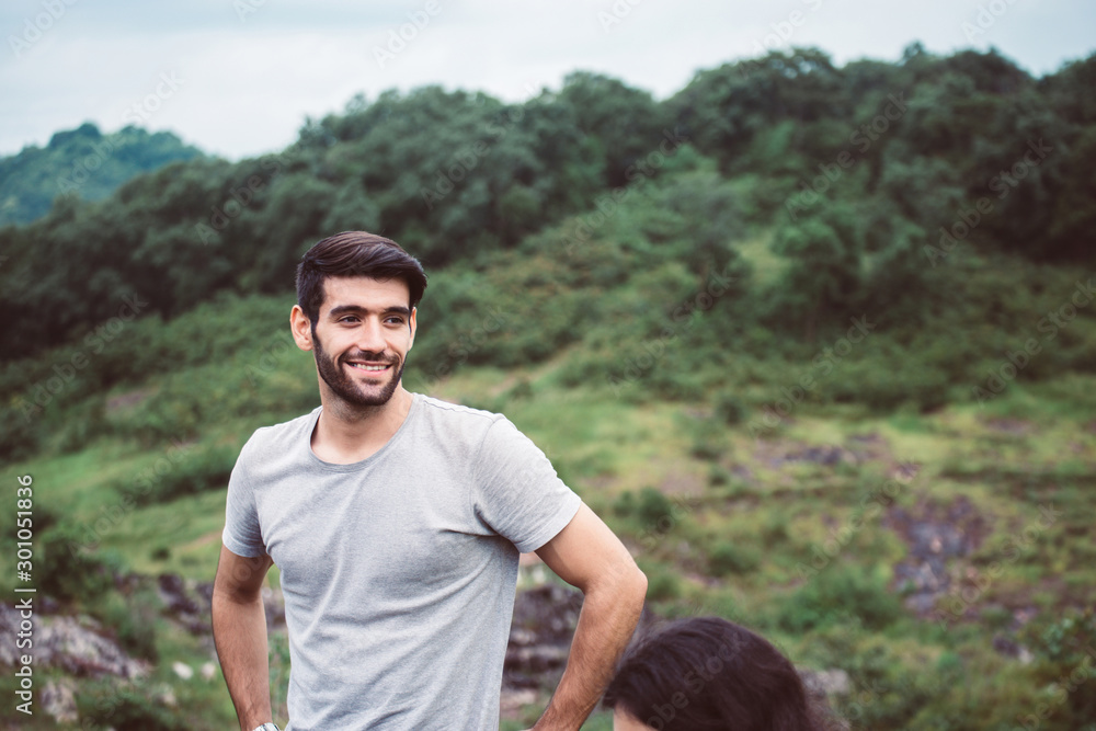 Handsome man standing and looking something at nature,Happy and smiling,Positive thinking,Travel at outdoor Handsome man standing and looking something at nature,Happy and smiling,Positive thinking,Travel at outdoor