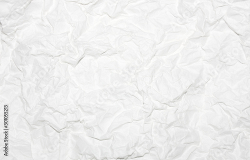 Wrinkles on white paper abstract background