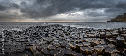 Panoramic view of the natural hexagonal stones at the coast called Giant's Causeway, a landmark in Northern Ireland.