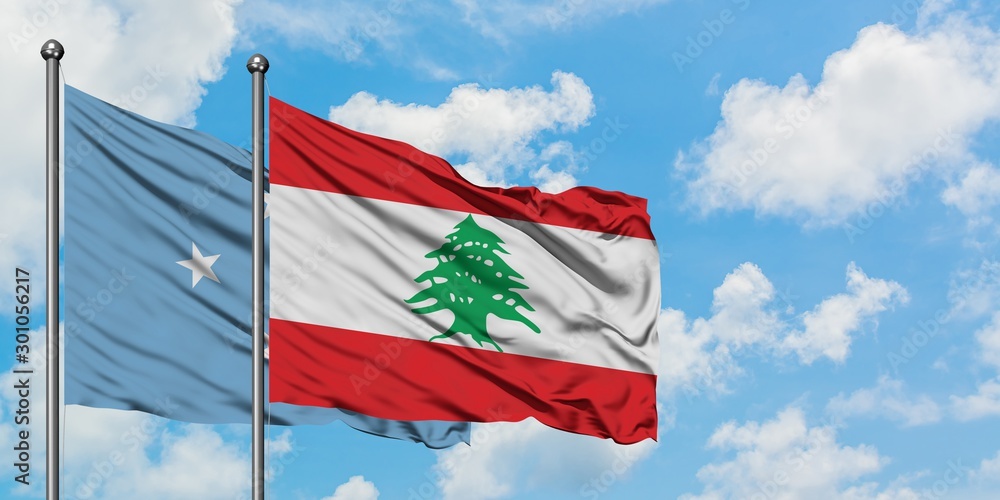 Micronesia and Lebanon flag waving in the wind against white cloudy blue sky together. Diplomacy concept, international relations. Micronesia and Lebanon flag waving in the wind against white cloudy blue sky together. Diplomacy concept, international relations.
