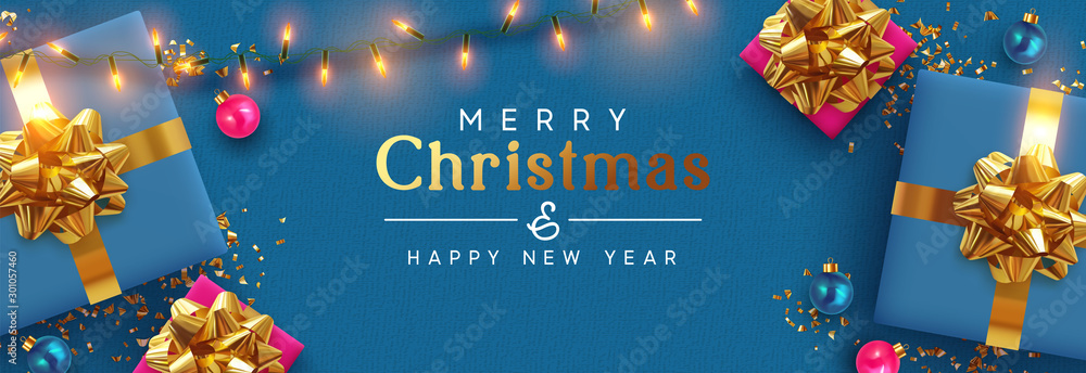 Holiday banner Merry Christmas and Happy New Year. Xmas design with realistic festive objects, blue gift box, lilac ball, light lamps garland, glitter gold confetti. Horizontal poster, flat top view - obrazy, fototapety, plakaty 