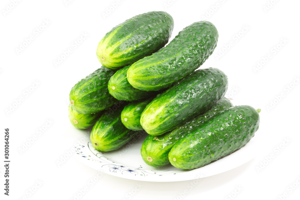green cucumbers on a white background green cucumbers on a white background