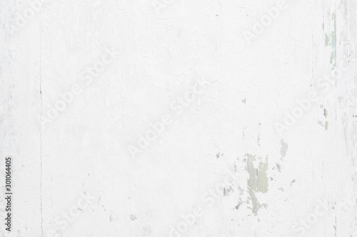 White grunge rusty painted urban texture on wood background
