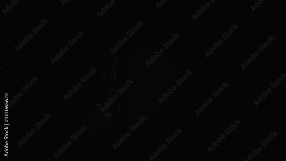 Hard drive spinning and being lighted by key light with dark background Hard drive spinning and being lighted by key light with dark background