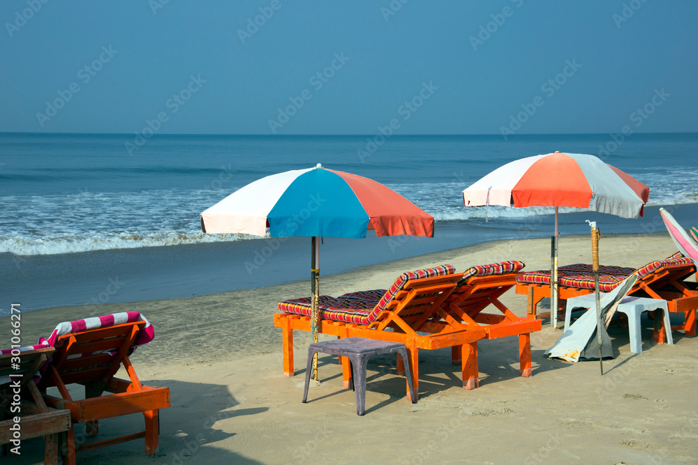 Sun umbrellas and chairs on beach