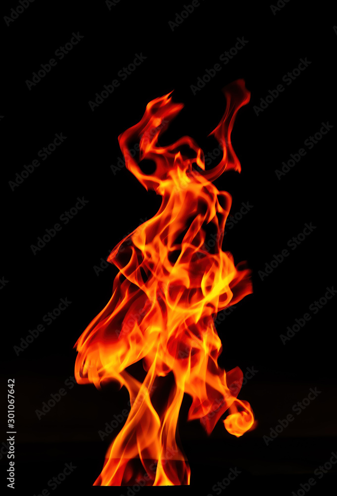 Fire flame isolated on black background. Beautiful Flame in the dark. Fire flame isolated on black background. Beautiful Flame in the dark.