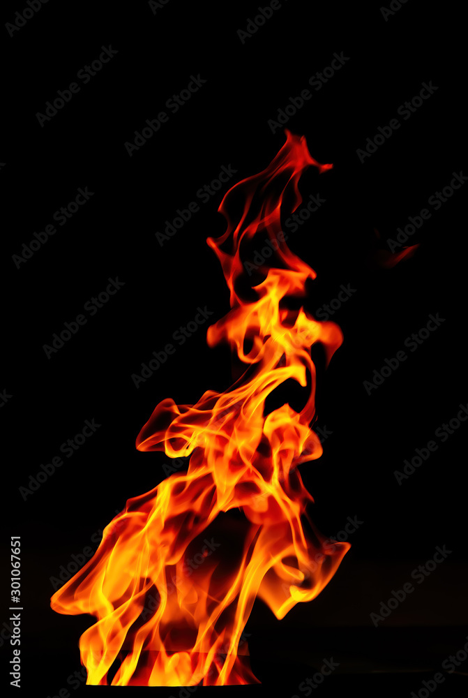 Fototapeta premium Fire flame isolated on black background. Expressive flame.