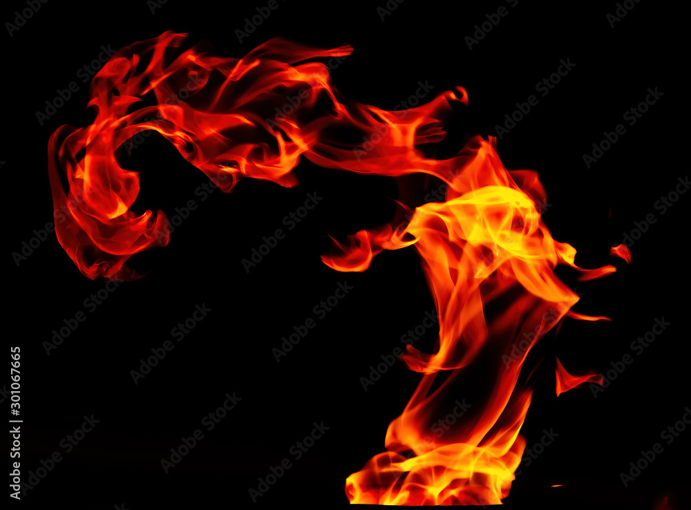 Fototapeta premium Fire flame isolated on black background. Shaman on fire.
