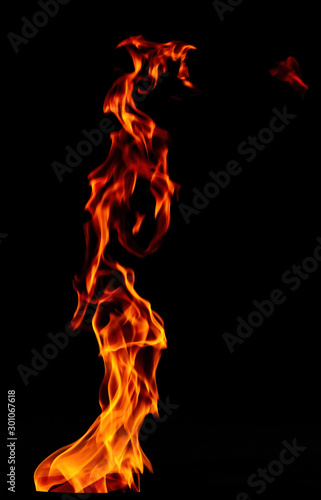 Fire flame isolated on black background. Beautiful pillar of fire.