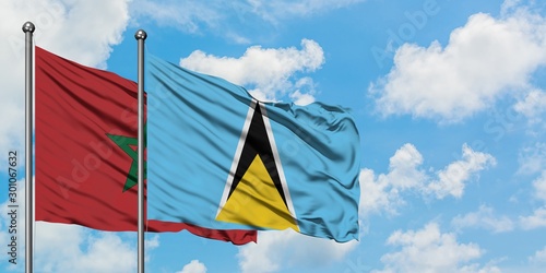 Morocco and Saint Lucia flag waving in the wind against white cloudy blue sky together. Diplomacy concept  international relations.
