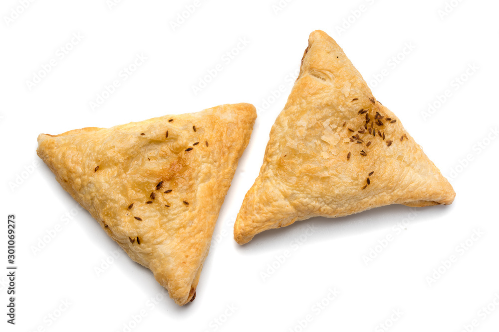 Triangular meat pie isolated on a white background.