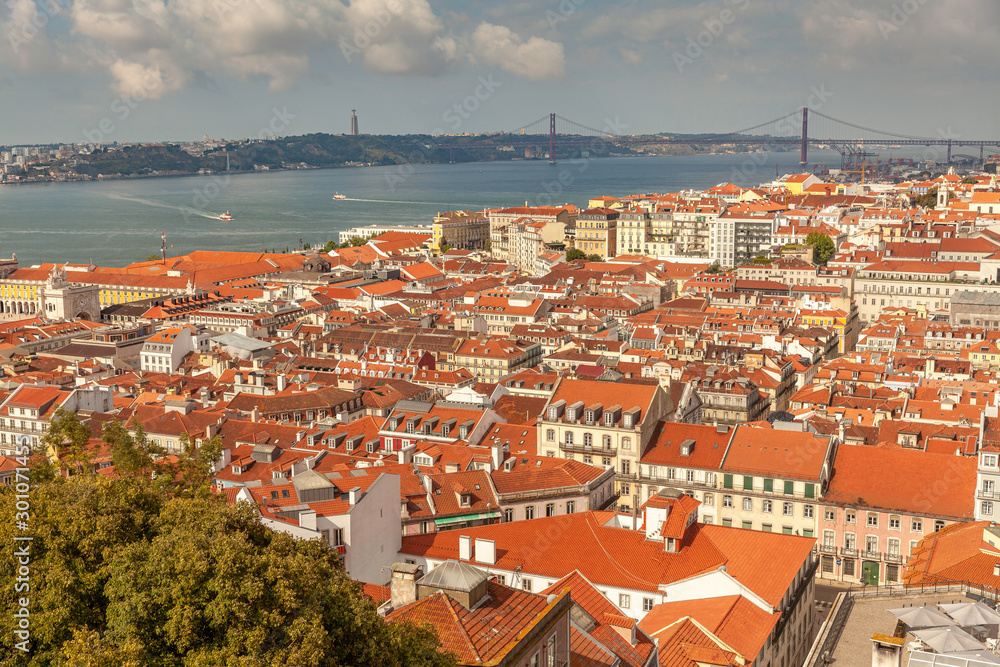 Aerial view on rooftops of Lisbon with river Tagus (Tajo), Portugal