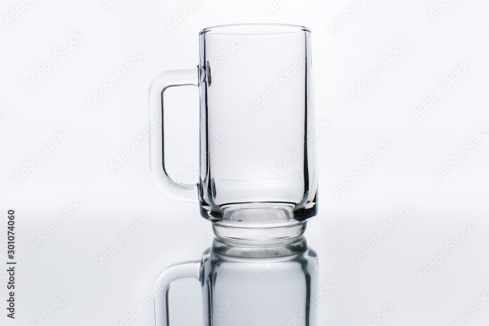An empty beer glass on a white background An empty beer glass on a white background