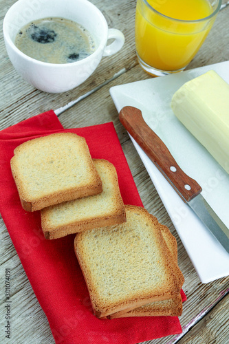 clump of butter and rusk on a wooden table
