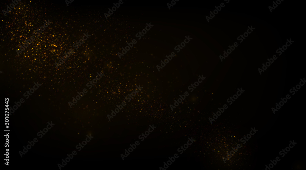 Fototapeta premium Glowing golden particles on black background 