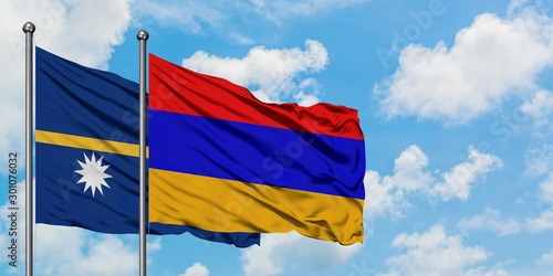Nauru and Armenia flag waving in the wind against white cloudy blue sky together. Diplomacy concept, international relations.