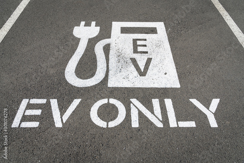 Electric vehicle logo on the ground of a parking space