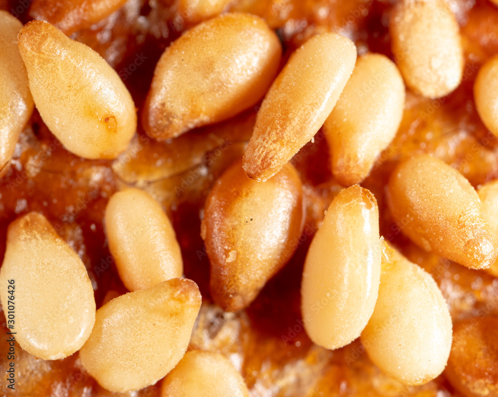 Sesame seeds on a brown crust of bread Sesame seeds on a brown crust of bread
