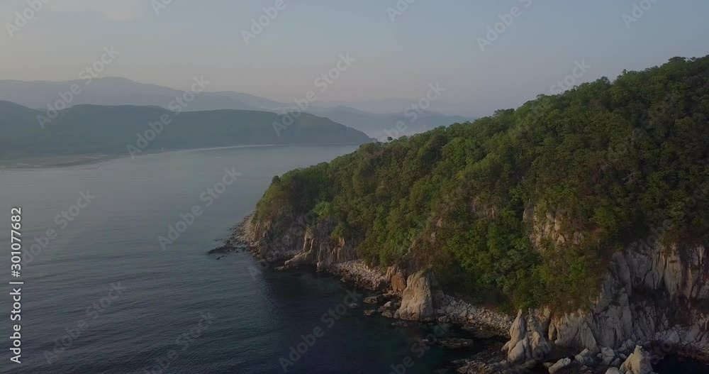 Shooting from above. Green island of Petrov in the Lazovsky reserve. The island with the world's only yew grove. Shooting from above. Green island of Petrov in the Lazovsky reserve. The island with the world's only yew grove.