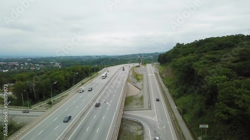 Arial. Flying over a busy federal highway in the suburbs of Vladivostok - the capital of Primorsky Krai and the Far East. Federal highway near the Rostral column of the city of Vladivostok. photo