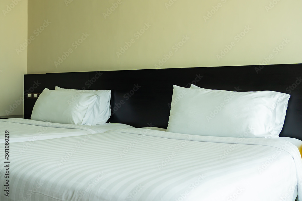Pillow and blanket on bed with light lamp decoration interior Pillow and blanket on bed with light lamp decoration interior
