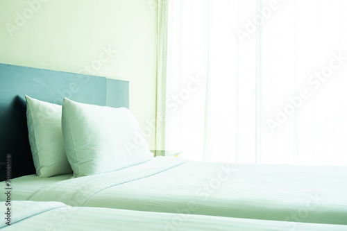 Pillow and blanket on bed with light lamp decoration interior