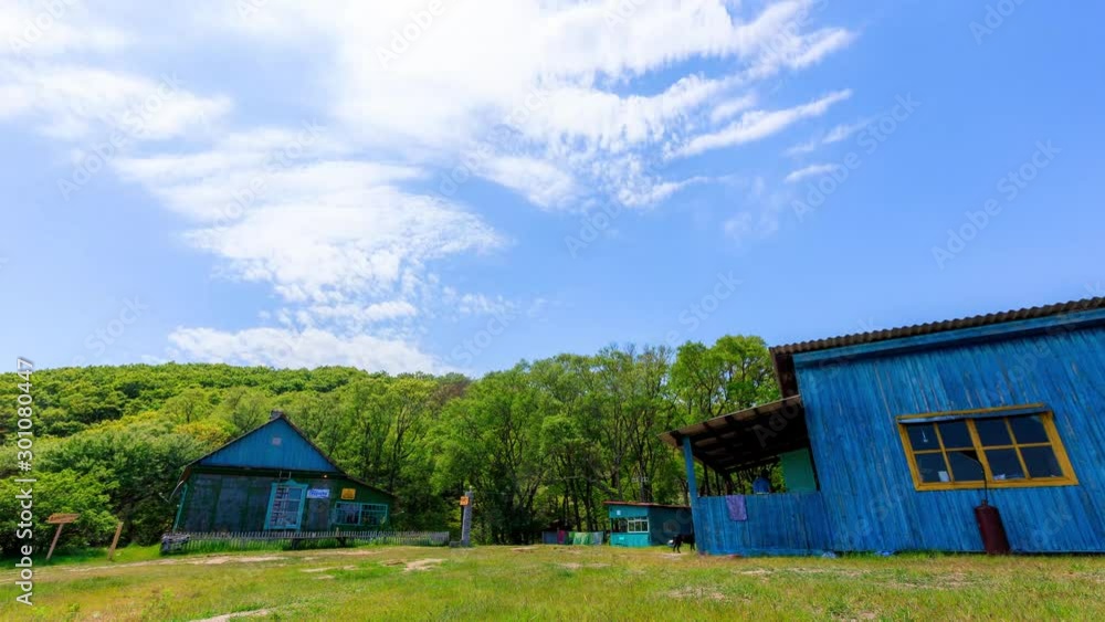 Time Laps. Wooden cordon Petrova island in the Lazovsky reserve in the Primorsky Territory. Wooden houses on the beach. Time Laps. Wooden cordon Petrova island in the Lazovsky reserve in the Primorsky Territory. Wooden houses on the beach.