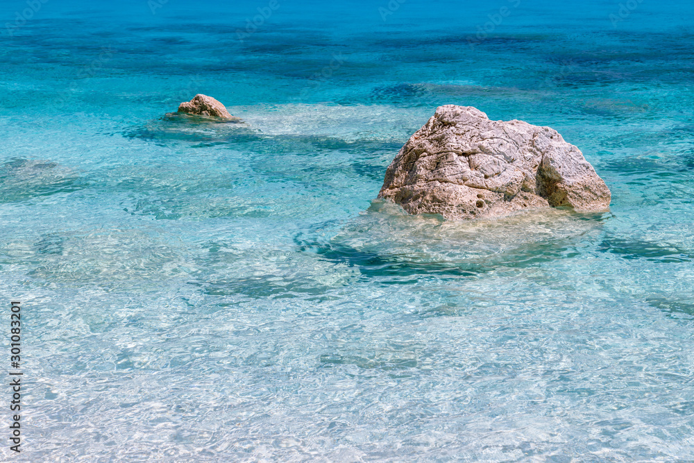 Rocks in the sea, crystal clear azure water of Sardinia island. Holidays, Cala Biriola Beach, Sardinia, Italy. 