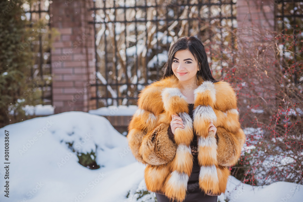 Vogue concept. Beautiful arabic lady in holidays, modern woman wear fur coat look . Fashionable lady outdoors portrait Vogue concept. Beautiful arabic lady in holidays, modern woman wear fur coat look . Fashionable lady outdoors portrait