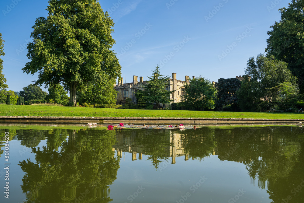 Castle surrounded by a garden with a lake Castle surrounded by a garden with a lake