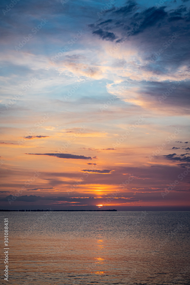 Fototapeta premium Colourful sunrise at the sea