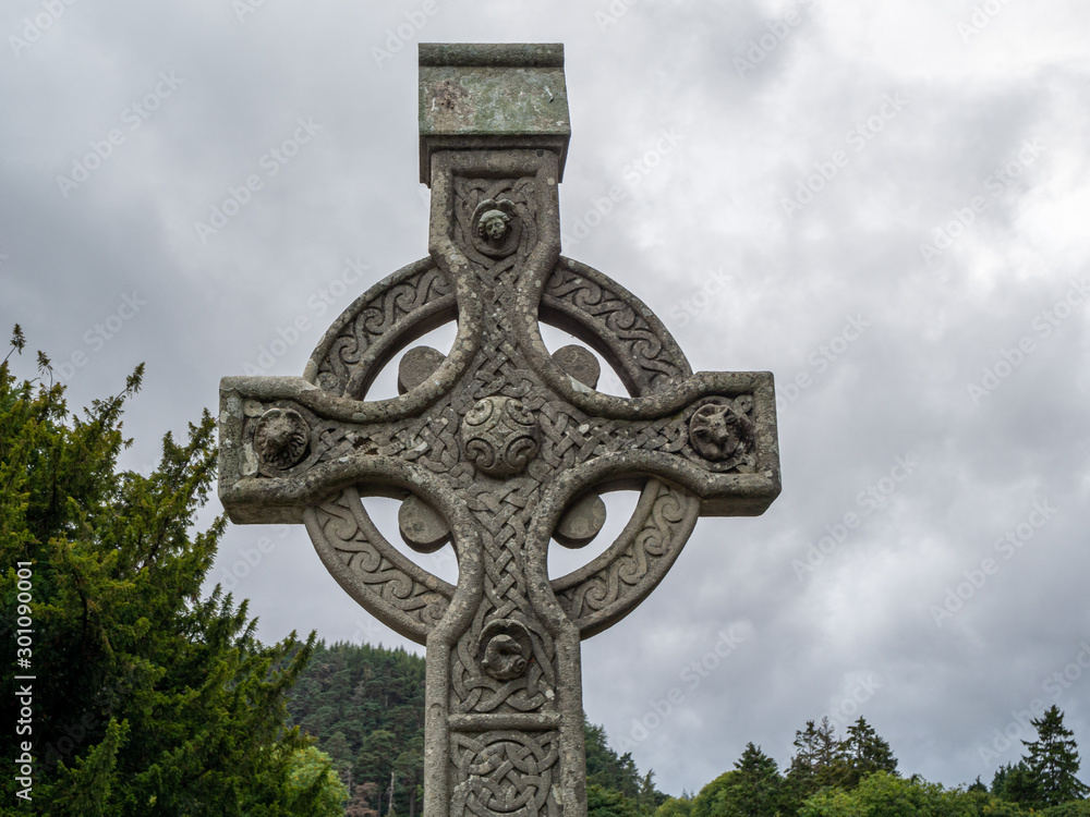 Traditional celtic cross tombstone with engraved ornaments 
