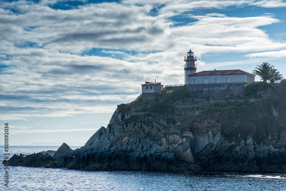 Cudillero, Asturias. Lighthouse on the cliff next to the village