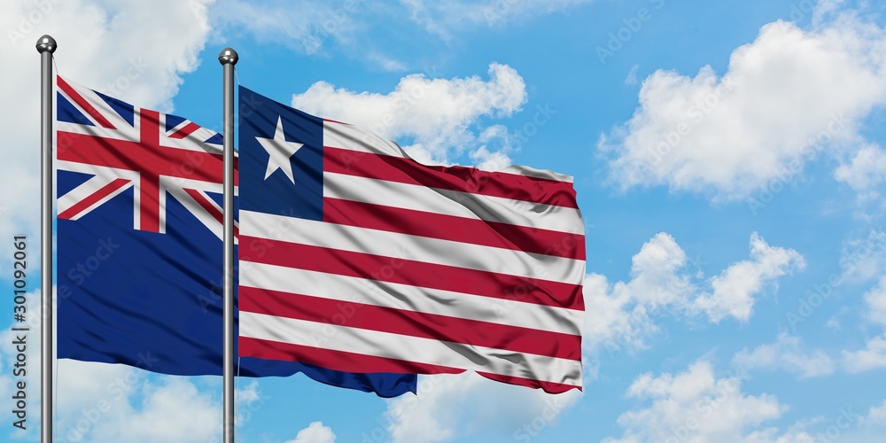 New Zealand and Liberia flag waving in the wind against white cloudy blue sky together. Diplomacy concept, international relations. New Zealand and Liberia flag waving in the wind against white cloudy blue sky together. Diplomacy concept, international relations.