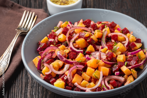 Potato and beetroot salad with olive oil dressing, vegetarian cuisine.