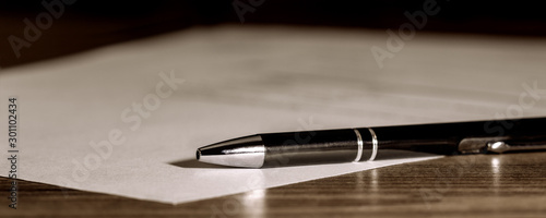 Fotografía Banner, pen and paper on wooden table, concept contract, submission or last will