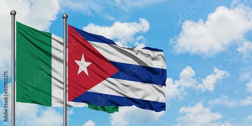 Photography Nigeria and Cuba flag waving in the wind against white cloudy blue sky together