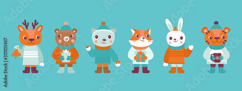 Funny cartoon animals in winter clothes and hats