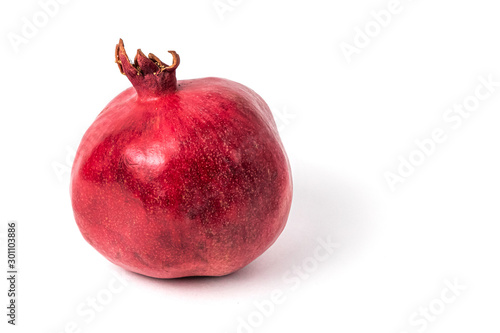 Closeup of pomegranate on white background. Isolated.