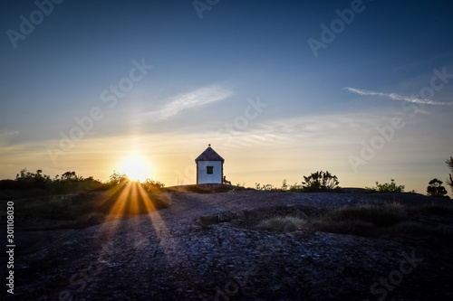 Man resting at sunset near with lighthouse Norway