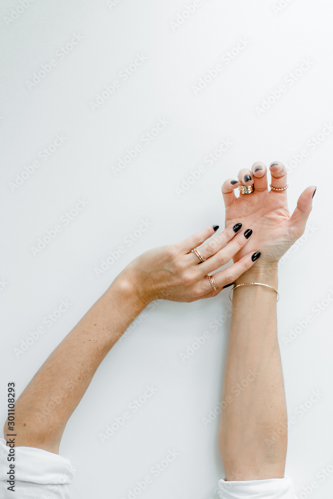 Hands with black manicured nails and accessoires Stock Photo | Adobe Stock