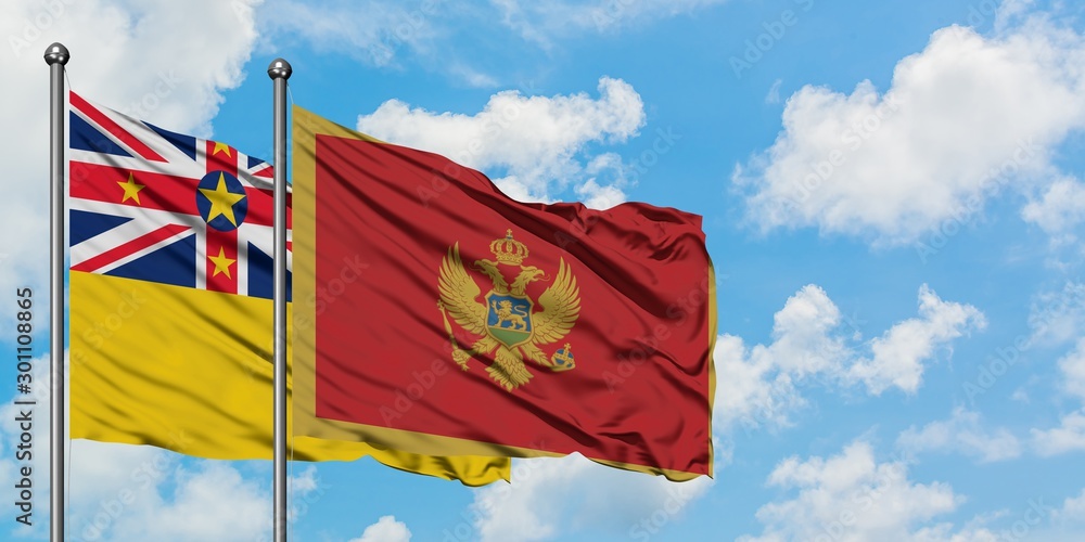 Niue and Montenegro flag waving in the wind against white cloudy blue sky together. Diplomacy concept, international relations.